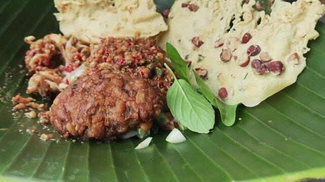 Pecel Freshly prepared meal served on a banana leaf