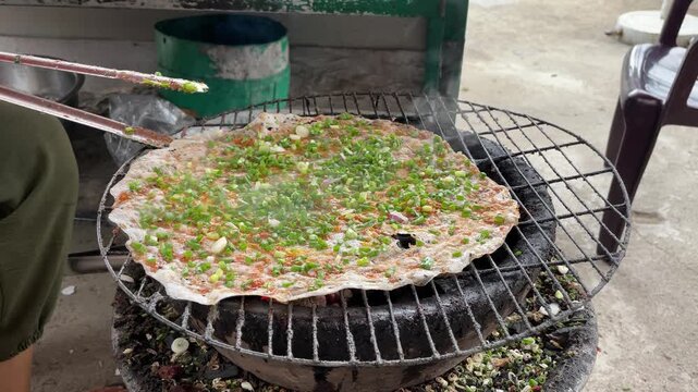 Vietnamese Grilled Rice Paper Banh Trang Nuong on Charcoal Grill