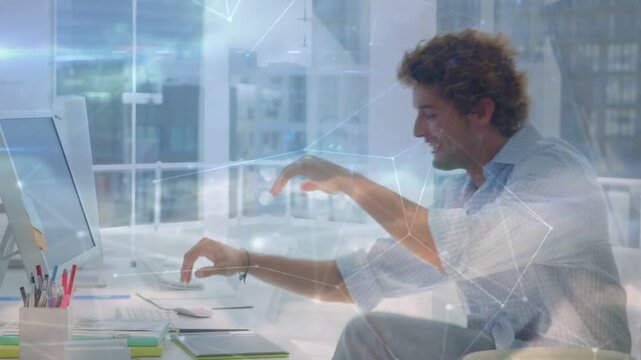 Man arriving desk, tapping tablet causing cloud overlay, sitting, typing to review business data