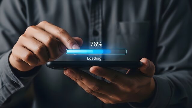 Person's hands are holding a black smartphone displaying a digital loading bar with "76% loading..." progress, indicating data transfer or software update.