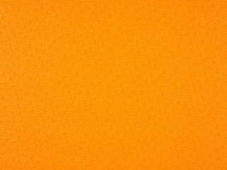 Naklejka premium Couverture orange d'un vieux livre ou d'un registre, ornée d'un motif léger qui se répète. Fond à motif régulier imitant la texture du papier vintage, idéal pour les arrière-plans et les projets.
