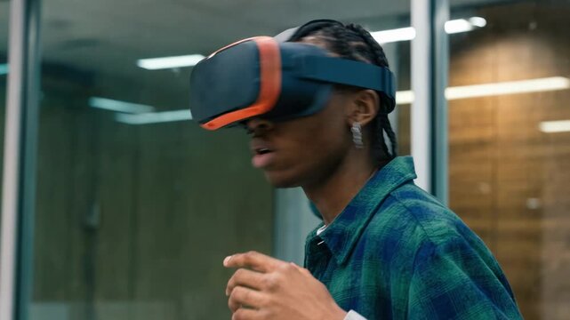 Close view of a young homebuyer navigating a virtual reality loan advisory booth concentrating on customizable repayment timelines while the background fades softly.