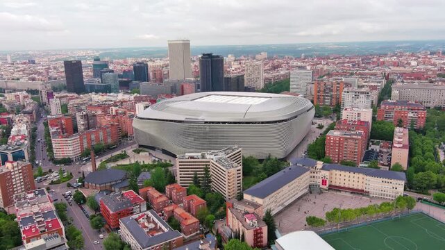 MADRID,SPAIN: Aerial view of the iconic Bernab&eacute;u football stadium, home of Real Madrid with its striking modern exterior, ideal for travel, sports or city footage.