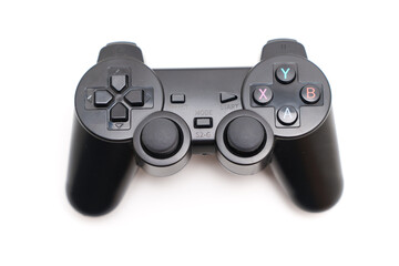Black game controller on a white background for gaming enthusiast © Maria