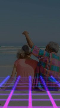 Vertical video: Pair sitting sea right man raising draping arm for comfort neon grid lower 3rd tech