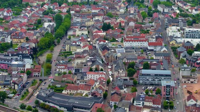 An aerial view around the old town in the city Merzig in the country of Germany on a cloudy spring afternoon .