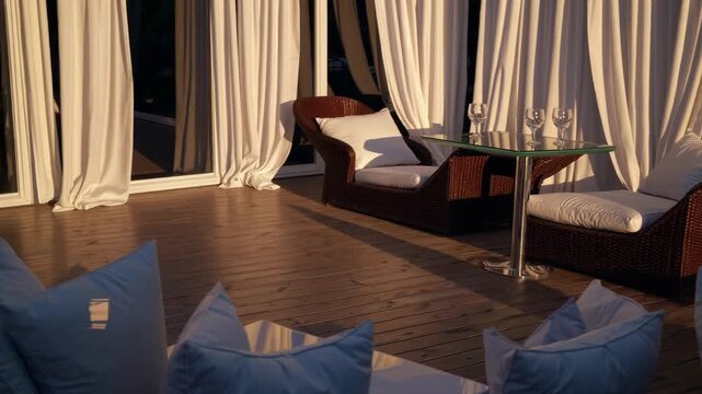 Elegant Evening Sanctuary. Charming Twilight Relaxation Area With Warm Lighting And Cozy Furniture. Idyllic Sunset Lounging Zone Featuring Inviting Seats And Soothing Ambient Illumination For Comfort