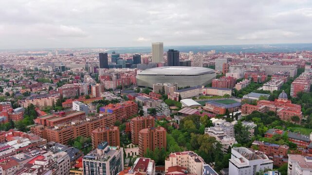 MADRID,SPAIN: Aerial view of the iconic Bernab&eacute;u football stadium, home of Real Madrid with its striking modern exterior, ideal for travel, sports or city footage.