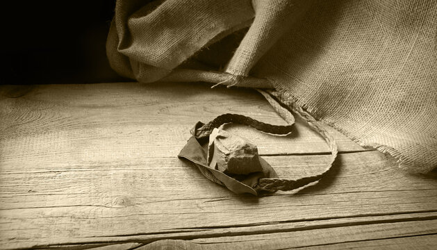 Old sling with a stone