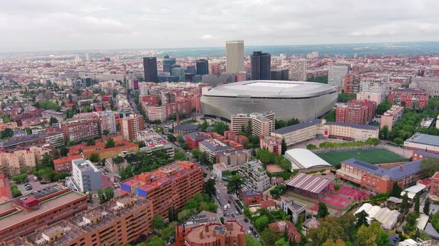 MADRID,SPAIN: Aerial view of the iconic Bernab&eacute;u football stadium, home of Real Madrid with its striking modern exterior, ideal for travel, sports or city footage.