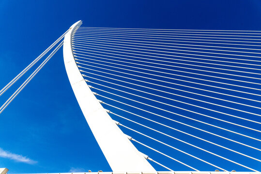 Cable stayed bridge pylon and cables against blue sky