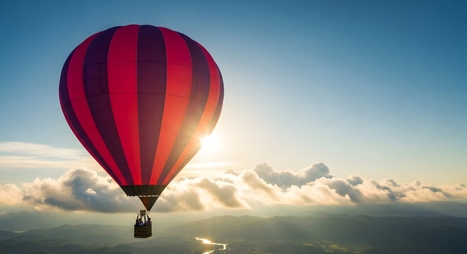 Red Hot Air Balloon Flying Above Clouds at Sunset with Blue Sky