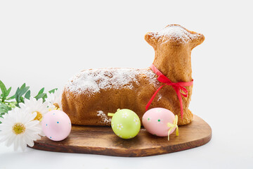 Easter lamb cake with decorative eggs and flowers