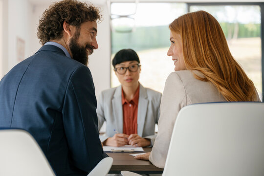 Businesswoman in job interview with experts in modern office