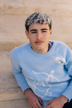 Outdoor close up portrait with confident direct gaze and calm mood