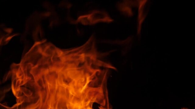 intense orange fire flames on black background