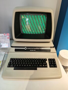 Russia, St. Petersburg, March 14, 2026 -Vintage Commodore 64 computer on display in a modern tech exhibit setting