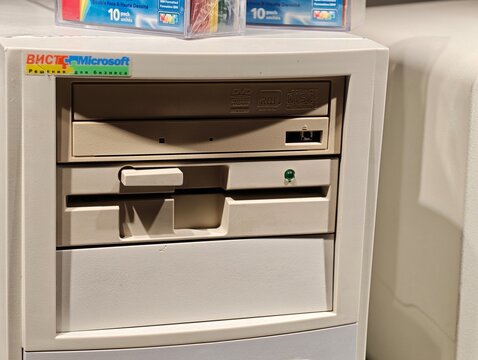 Russia, St. Petersburg, March 14, 2026 -Old computer hardware with floppy disk and CD drive in a tech setting