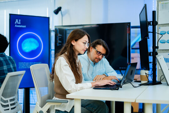 software engineer or programmer team working late in development office,problem solving or algorithm of ai assistant,ai agent helping for work.software developer,digital technology security concept
