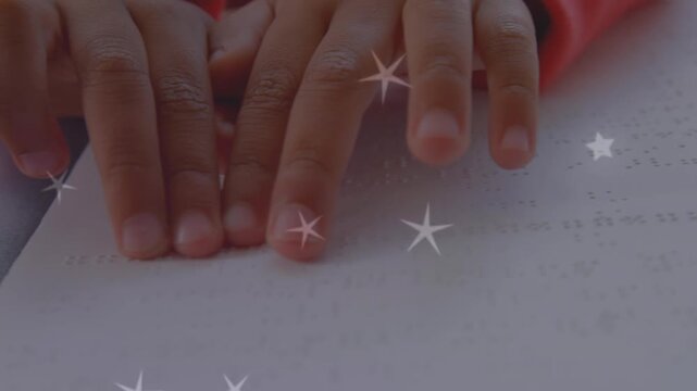 Animation of stars over hands reading braille