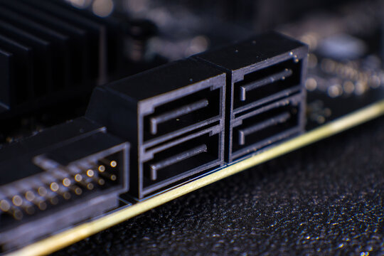Close-up view of computer hardware connections on a motherboard in a technology setting