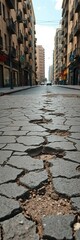 Fototapeta premium Cracked city street with numerous potholes, a visual metaphor for urban decay, urban infrastructure, urban neglect
