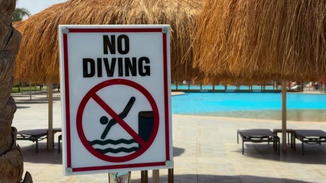 Pool Safety Notice. Sign Informing Guests That Diving Is Strictly Forbidden In Shallow Pool Area