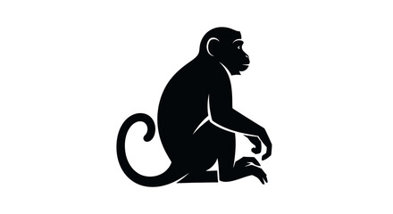 Black silhouette of a monkey sitting and looking to the side on a white background © difka