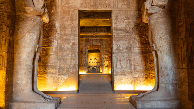 Abu simbel temple interior presenting ancient egyptian architecture, colossal statues, and carved hieroglyphs
