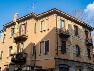 Obraz premium Old residential building along Piazza Firenze in Milan, Italy.