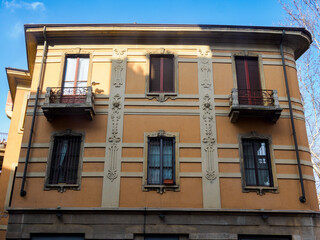 Fototapeta premium Old residential building along Piazza Firenze in Milan, Italy.