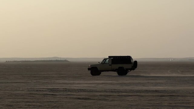 4x4 SUV dune bashing in desert dunes, off-road adventure in Qatar, desert safari action