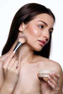 Woman, makeup brush and blush in studio, beauty and grooming products on white background. F