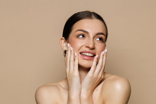 Beautiful woman after spa treatment on beige background, closeup. Space for text