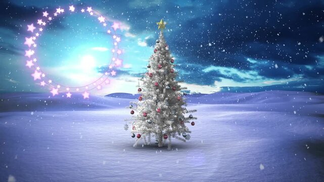Decorative shining star lights against snowflakes falling over christmas tree on winter landscape