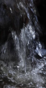 Real Authentic Spring Forest Stream Waterfall Close-Up Macro With Bubbles Splashes Drops and Glints Front View Vertical Natural Light Sound Static Shot No People