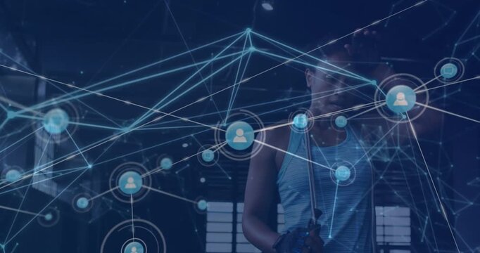 Network of digital icons against tired african american fit woman taking a break at the gym