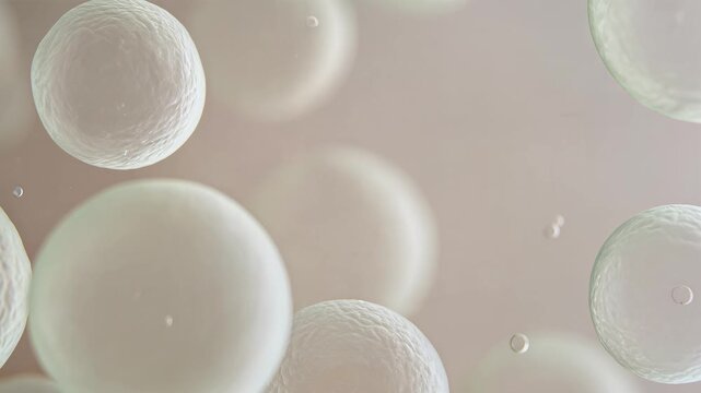 Several white bubbles float in the air with a pale background.