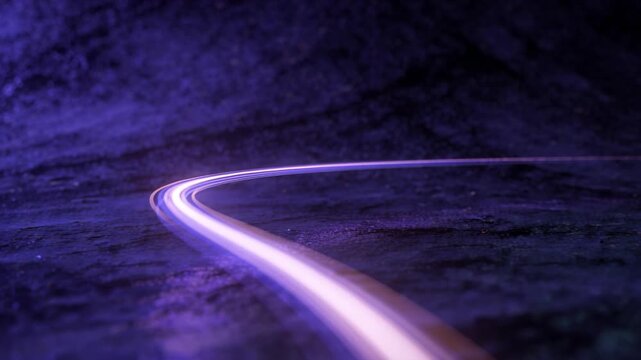 Glowing trail moving toward foreground across wet rock floor, with purple halo reflection