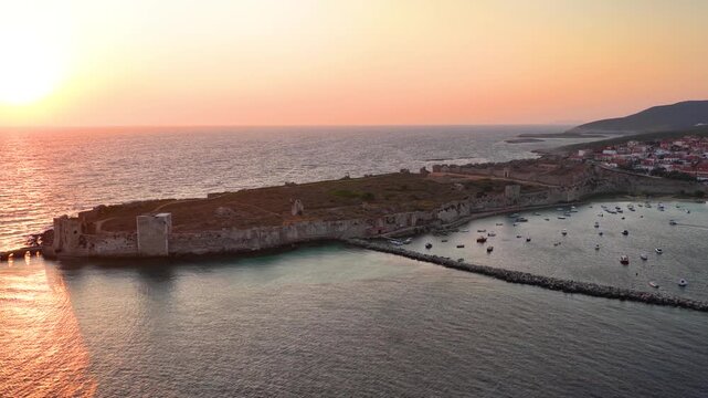 Establilshing aerial view of the old venetian Castle in the town of Methoni, Messenia, Peloponnese, Greece, during sunset time