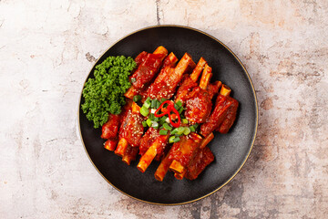 돼지고기의 갈비의 등 쪽에 붙어 있는 부분. 또는 등에 붙은 갈비. The part of pork ribs attached to the back. Or ribs attached to the back.   © jinho Park