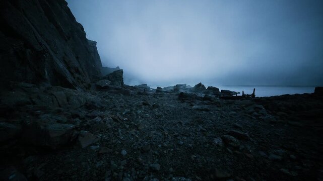 rocky shore under moody blue fog, cinematic palette suited for mystery shorts, atmospheric trailers, adventure montages and ambient loops jagged rocks