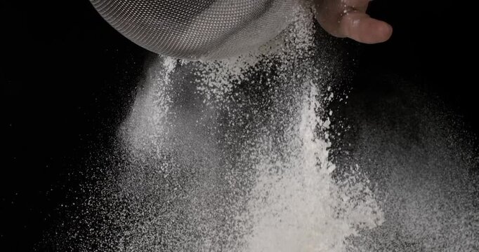 Super slow motion, Pastry Chef Pouring Granulated Sugar In Highcontrast Studio
