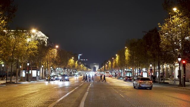 Champs-&Eacute;lys&eacute;es in Paris France at night with Arc de Triomphe in Background