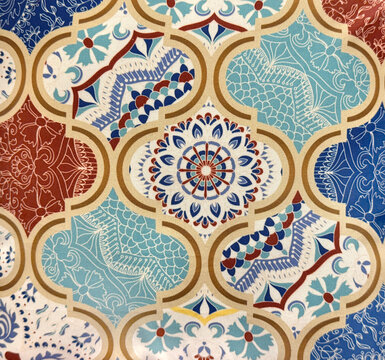 Close up of colorful vibrant Morocco and Islamic middle eastern ornamental graphic background. Indian, Mughal, Arabic and middle east design pattern. Wallpaper and fabric. Seamless background texture.