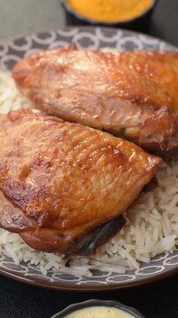 Kabsa or haneeth, an Arabic dish with rice and chicken, salt, and spices. Kabsa or haneeth as a food background for your design