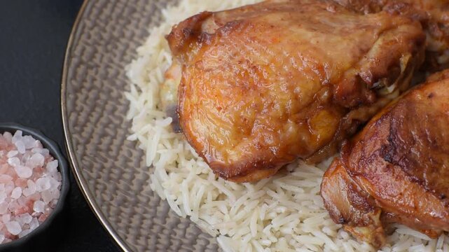 Kabsa or haneeth, an Arabic dish with rice and chicken, salt, and spices. Kabsa or haneeth as a food background for your design