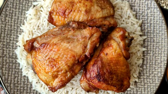 Kabsa or haneeth, an Arabic dish with rice and chicken, salt, and spices. Kabsa or haneeth as a food background for your design