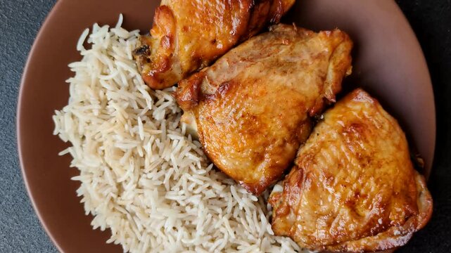 Kabsa or haneeth, an Arabic dish with rice and chicken, salt, and spices. Kabsa or haneeth as a food background for your design