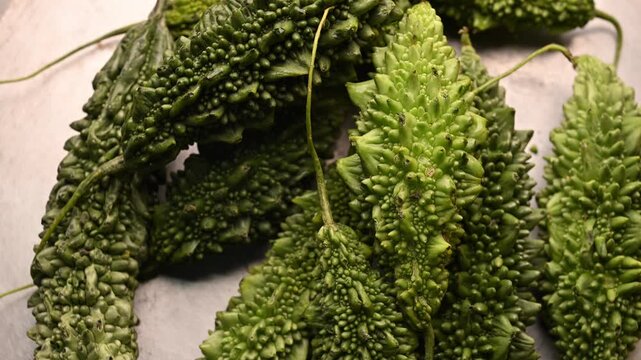 Rotating Top View of Fresh Bitter Gourd (Karela) &ndash; Green Vegetable Footage